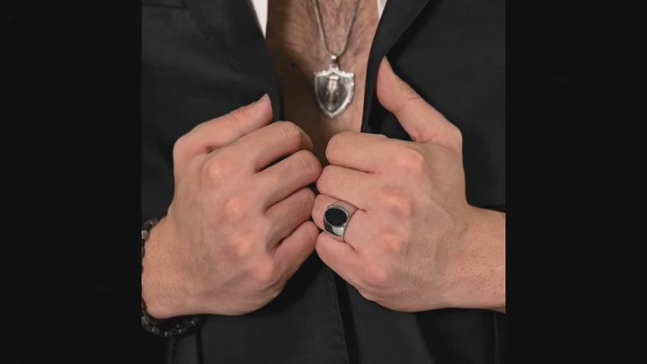 onyx stone wide ring on a man's hand